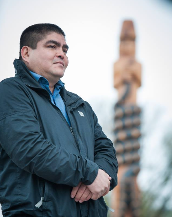 Musqueam artist Brent Sparrow Jr. carved the new Musqueam Post during UBC’s Centennial year. Photo credit: Martin Dee